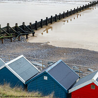Buy canvas prints of Colourful waterside beach huts by Chris Yaxley