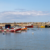 Buy canvas prints of Fishing boats in Staithes harbour, North Yorkshire by Chris Yaxley
