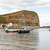 Buy canvas prints of Commercial fishing boats moored in Staithes harbour on the North Yorkshire coast by Chris Yaxley