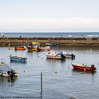 Buy canvas prints of Staithes' harbour, North Yorkshire by Chris Yaxley