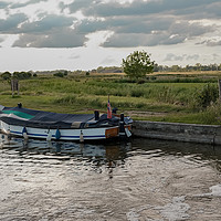 Buy canvas prints of Moored on Thurne Dyke at dusk by Chris Yaxley