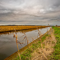 Buy canvas prints of Norfolk waterway on a cloudy day by Chris Yaxley