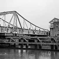 Buy canvas prints of Black and white photo of the Reedham swing bridge by Chris Yaxley