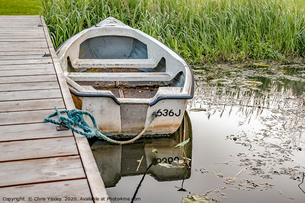 Boat tied to wooden staging on the Norfolk Broads Picture Board by Chris Yaxley