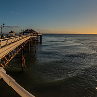 Buy canvas prints of Fisheye view along Cromer Pier at sunrise by Chris Yaxley