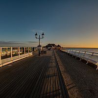 Buy canvas prints of Fisheye view captured on Cromer pier at sunrise by Chris Yaxley