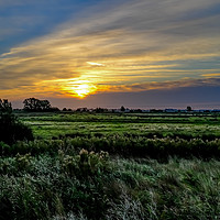 Buy canvas prints of Sunrise over the grazing marshes in South Walsham, by Chris Yaxley