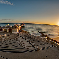 Buy canvas prints of Fisheye view of Cromer pier at sunrise by Chris Yaxley