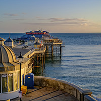 Buy canvas prints of View over Cromer Pier at sunrise by Chris Yaxley