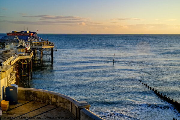 Cromer pier and promenade at sunrise Picture Board by Chris Yaxley