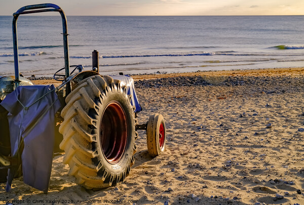 Rear view of tractor on Cromer beach at sunrise Picture Board by Chris Yaxley