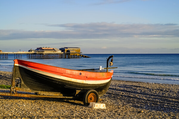 Crab fishing boat at sunrise on Cromer beach, Norfolk Picture Board by Chris Yaxley