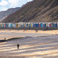 Buy canvas prints of Colorful beach huts on the promenade, North Norfolk coast by Chris Yaxley