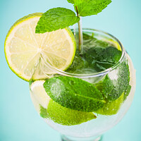Buy canvas prints of Glass of fresh mojito cocktail  by Laurent Renault