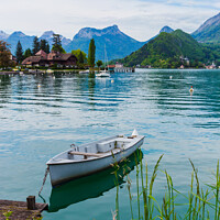 Buy canvas prints of Wooden boat on the lake of Annecy by Laurent Renault