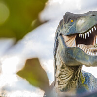Buy canvas prints of Scary Tyrannosaurus Rex or T-Rex photography with a blurry foreg by Laurent Renault