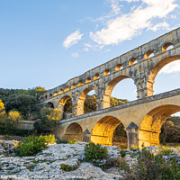 Buy canvas prints of Famous Pont du Gard, at setting sun. Photography taken in Proven by Laurent Renault
