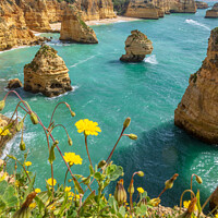 Buy canvas prints of Vertical view over cliffs and ocean near Lagoa, Algarve, Portuga by Laurent Renault
