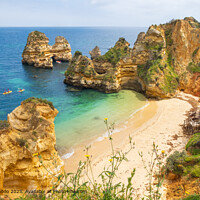Landscape overlooking Praia do Camilo and canoes near Lagos in Portugal
