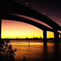 Buy canvas prints of Sunset Over The Sir Leo Hielscher Bridges. by Shaun Carling