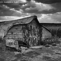Buy canvas prints of Traditional boat sheds of Lindisfarne  by Navin Mistry