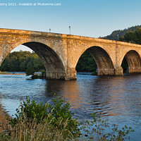 Buy canvas prints of Dunkeld Bridge illuminated by the sunset by Navin Mistry