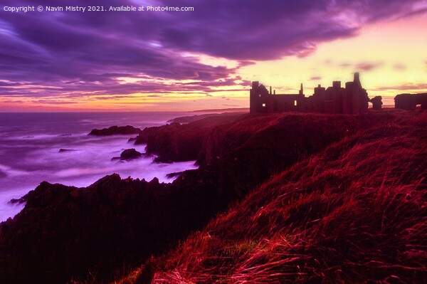 Slains Castle seen at sunset with a stormy sky  Picture Board by Navin Mistry