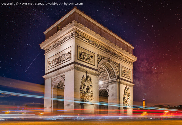 A night time view of the Arc de Triomphe, Paris Picture Board by Navin Mistry