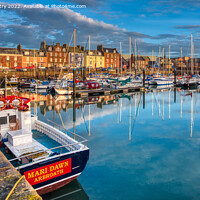 Buy canvas prints of A view of the harbour at Arbroath, Scotland by Navin Mistry