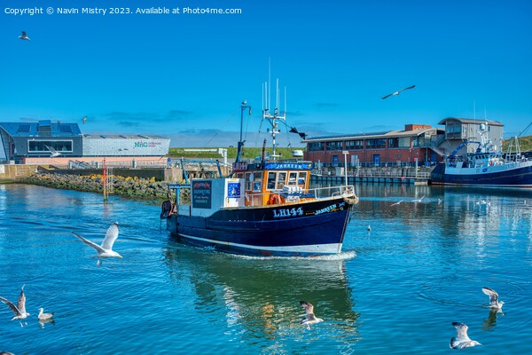 A Fishing Boat arrives in Eyemouth Harbour Picture Board by Navin Mistry