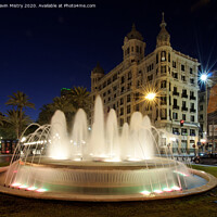 Buy canvas prints of A fountain lit up at night, Alicante, Spain by Navin Mistry