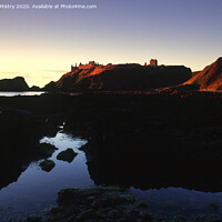 Buy canvas prints of First light on Dunnottar Castle near Stonehaven by Navin Mistry