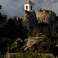 Buy canvas prints of The bell tower of the church of El Castell de Guadalest   by Navin Mistry