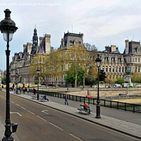 Buy canvas prints of A street scene of Paris with typical Haussmann Buildings by Navin Mistry