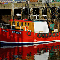 Buy canvas prints of A red Fishing boat in Cromarty Harbour  by Navin Mistry