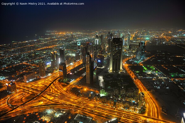 A night time view over Dubai, UAE, seen from the Burj Khalifa Picture Board by Navin Mistry