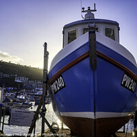 Buy canvas prints of Fishing boat docked in Mevagissey Harbour, Cornwall, England. by Gordon Maclaren