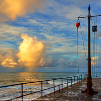 Buy canvas prints of Sunrise over the Cornish Sea, photographed from Porthleven jetty by Gordon Maclaren