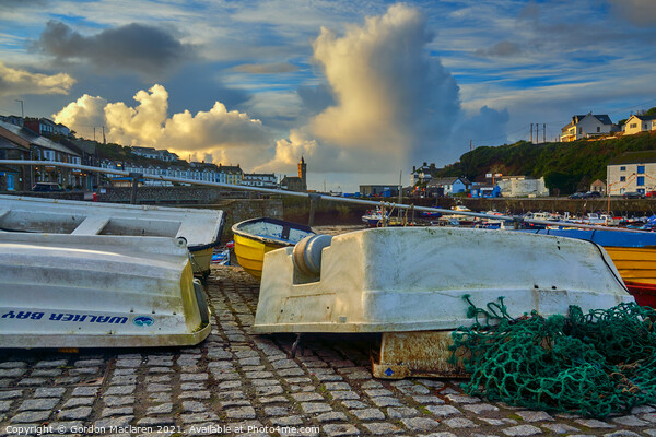 Upturned boats in Porthleven Harbour  Picture Board by Gordon Maclaren