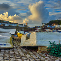 Buy canvas prints of Upturned boats in Porthleven Harbour  by Gordon Maclaren