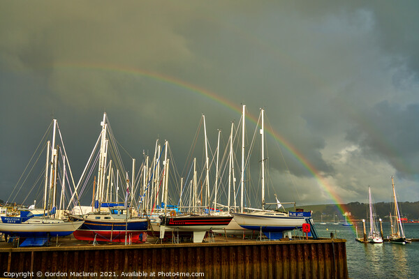 Rainbow over the boats docked in Falmouth Harbour Picture Board by Gordon Maclaren