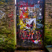 Buy canvas prints of Graffiti covered doorway, Falmouth by Gordon Maclaren