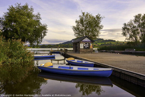 Boats moored in Llangorse Lake, Brecon Beacons, Wales Picture Board by Gordon Maclaren