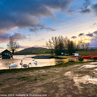 Buy canvas prints of Swans on Llangorse Lake at sunset  by Gordon Maclaren