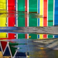 Buy canvas prints of Reflections of Barry Island Beach Huts  by Gordon Maclaren