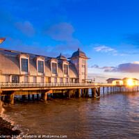 Buy canvas prints of Winter sunrise reflecting off Penarth Pier by Gordon Maclaren