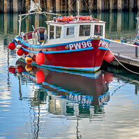 Buy canvas prints of A fishing boat moored in Padstow Harbour  by Gordon Maclaren