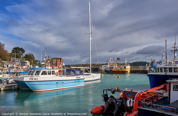 Boats moored in Padstow Harbour Cornwall Picture Board by Gordon Maclaren