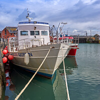 Buy canvas prints of Fishing Boat docked in Padstow Harbour, Cornwall by Gordon Maclaren