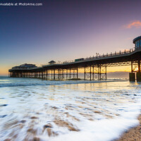 Buy canvas prints of Cromer pier at sunrise on a clear sky morrning  wi by Richard O'Donoghue